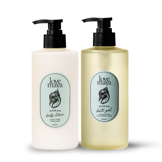 Two bottles of Love Maya Ocean body lotion and bath gel on a white background